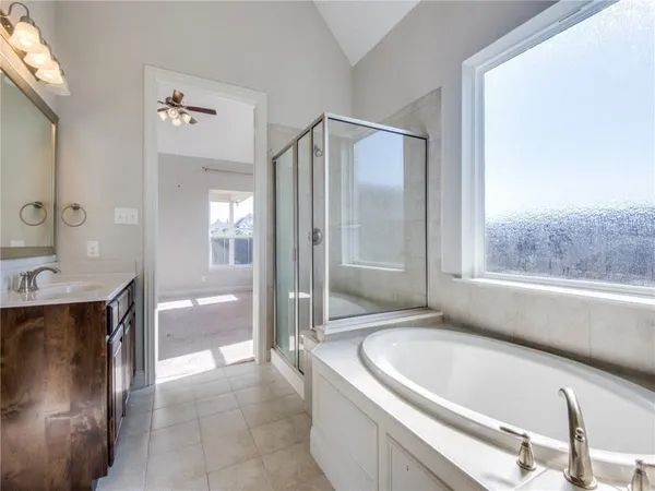 a bathroom with a bathtub and a sink