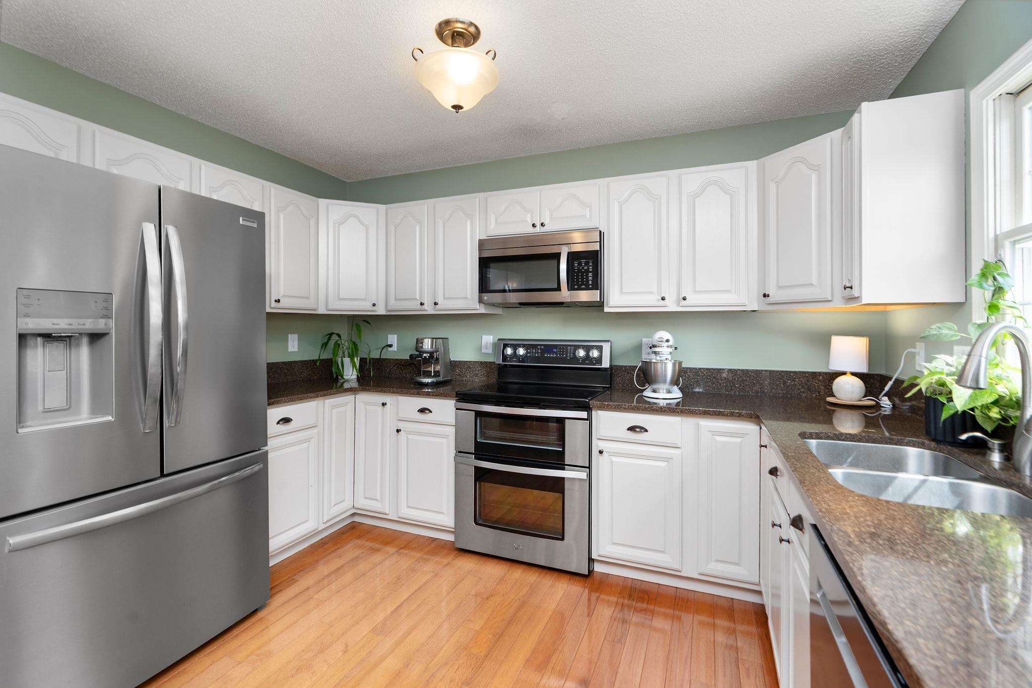 162 Cold Springs Road Stuarts Draft, VA 24477 - Photo 12 of 33 a kitchen with a refrigerator and a stove top oven