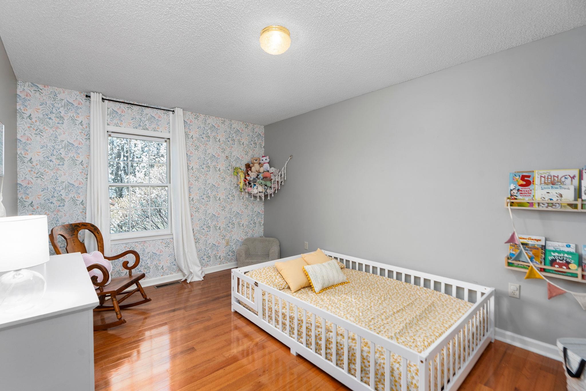 162 Cold Springs Road Stuarts Draft, VA 24477 - Photo 20 of 33 a bedroom with furniture and a wooden floor