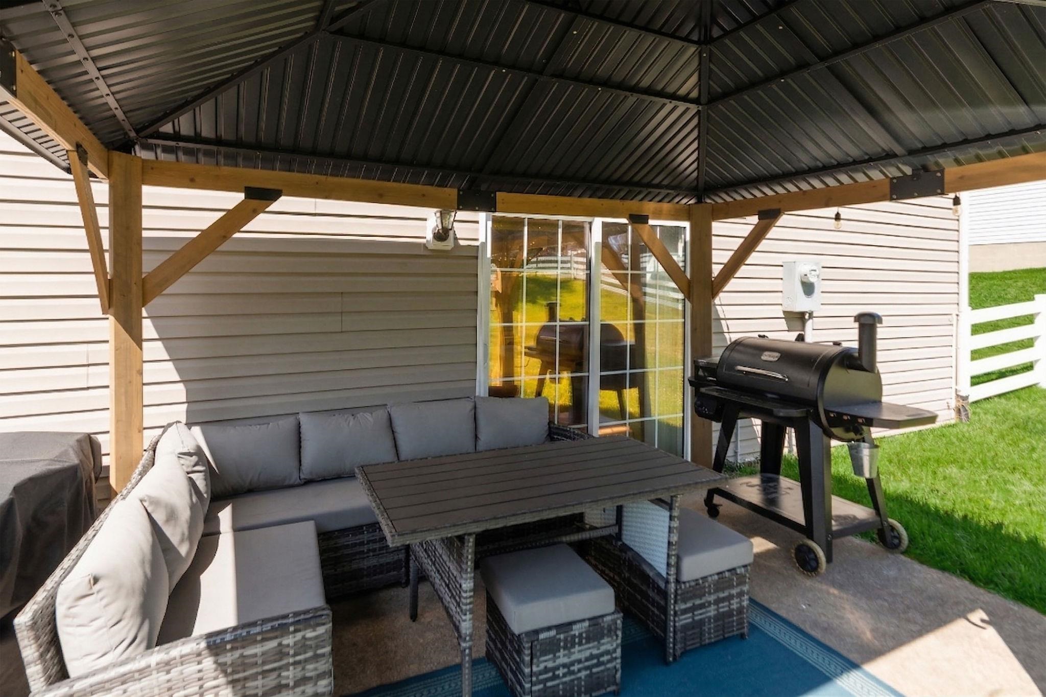 162 Cold Springs Road Stuarts Draft, VA 24477 - Photo 30 of 33 a backyard of a house with barbeque oven table and chairs