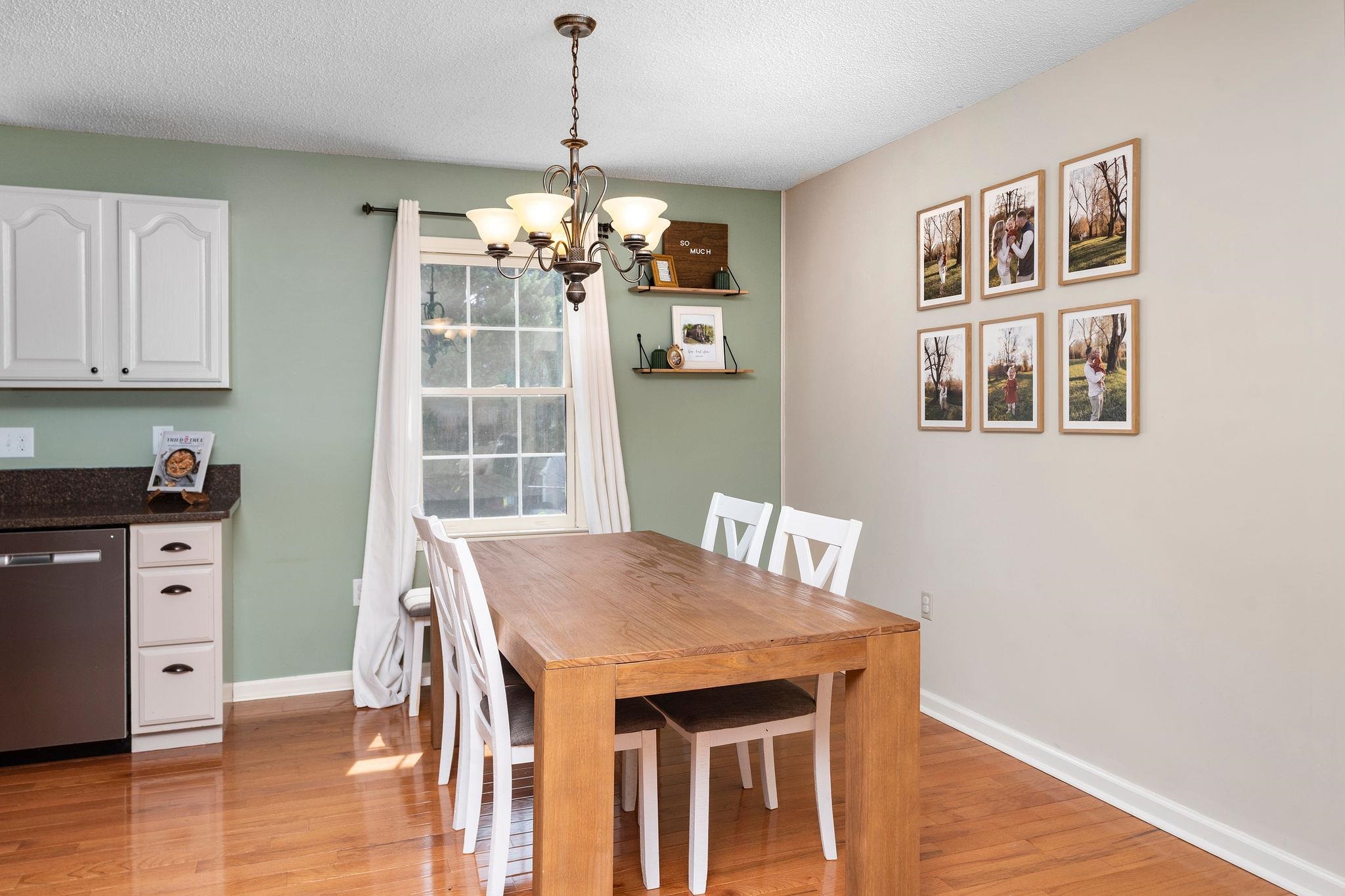 162 Cold Springs Road Stuarts Draft, VA 24477 - Photo 8 of 33 a view of a dining room with furniture wooden floor and chandelier