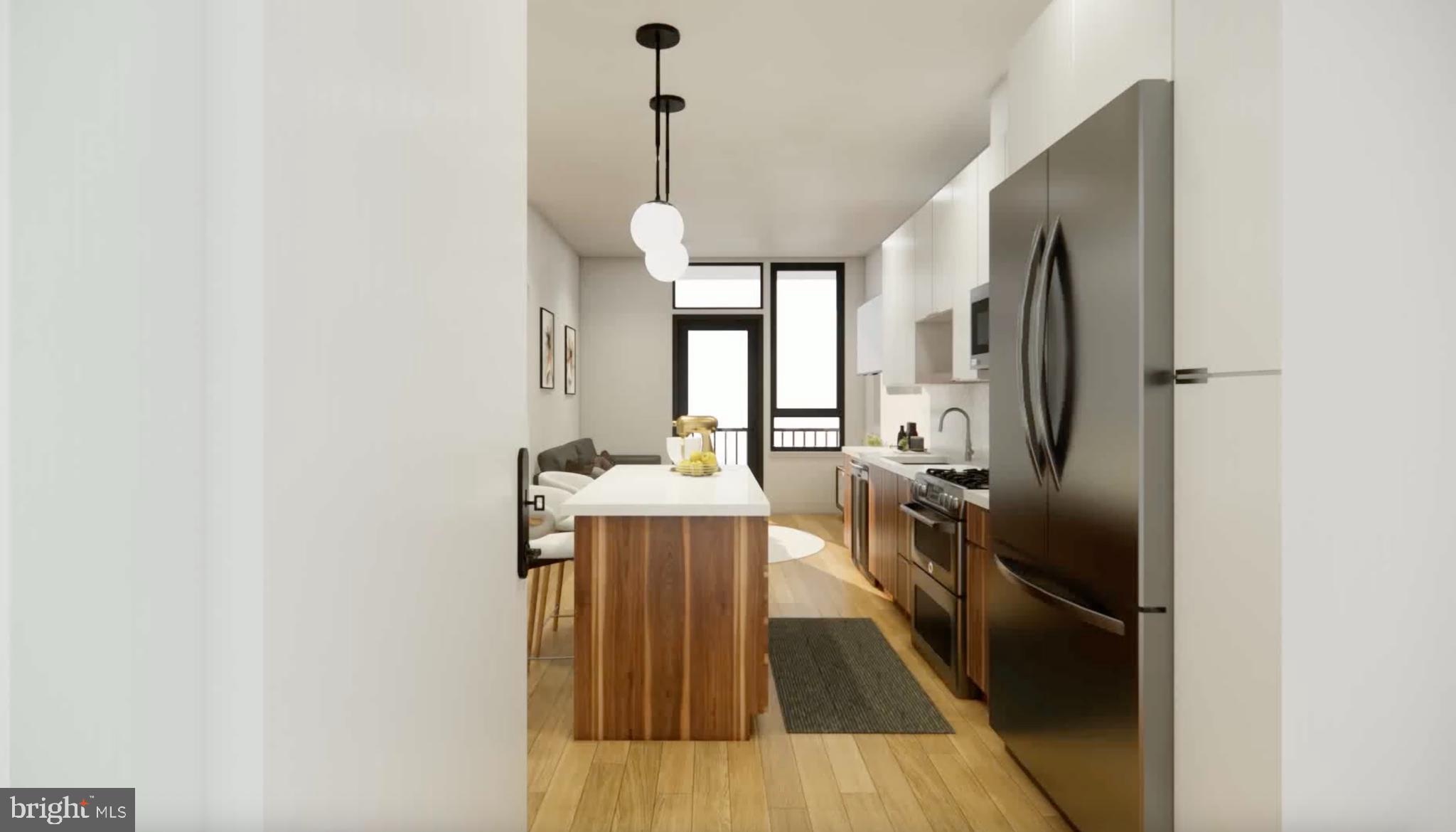 7175 12th Street Northwest, Unit 608 Washington, DC 20012 - Photo 1 of 24 a kitchen with kitchen island a counter top space a sink stainless steel appliances and cabinets
