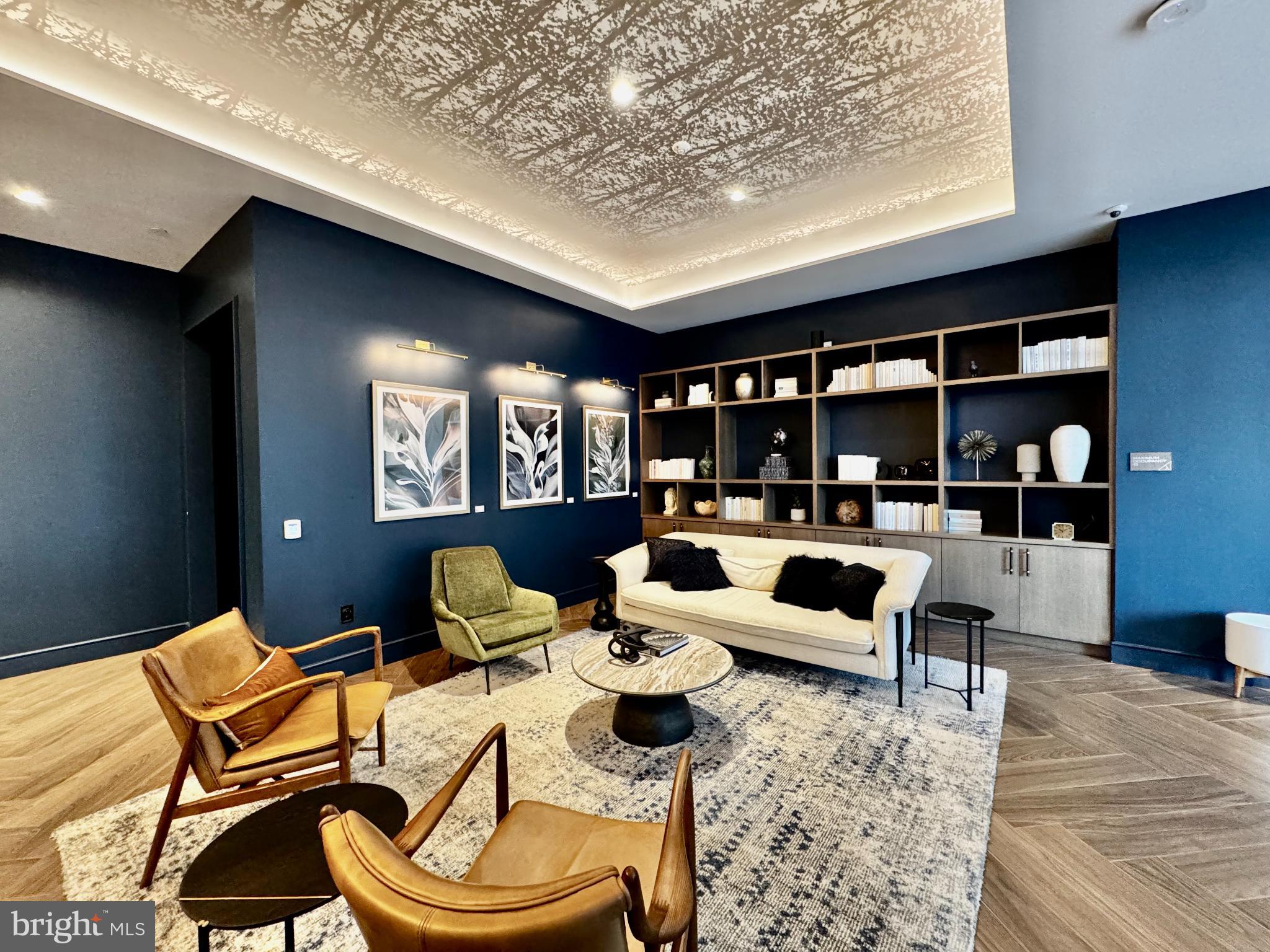 7175 12th Street Northwest, Unit 608 Washington, DC 20012 - Photo 17 of 24 a living room with furniture lamp and rug