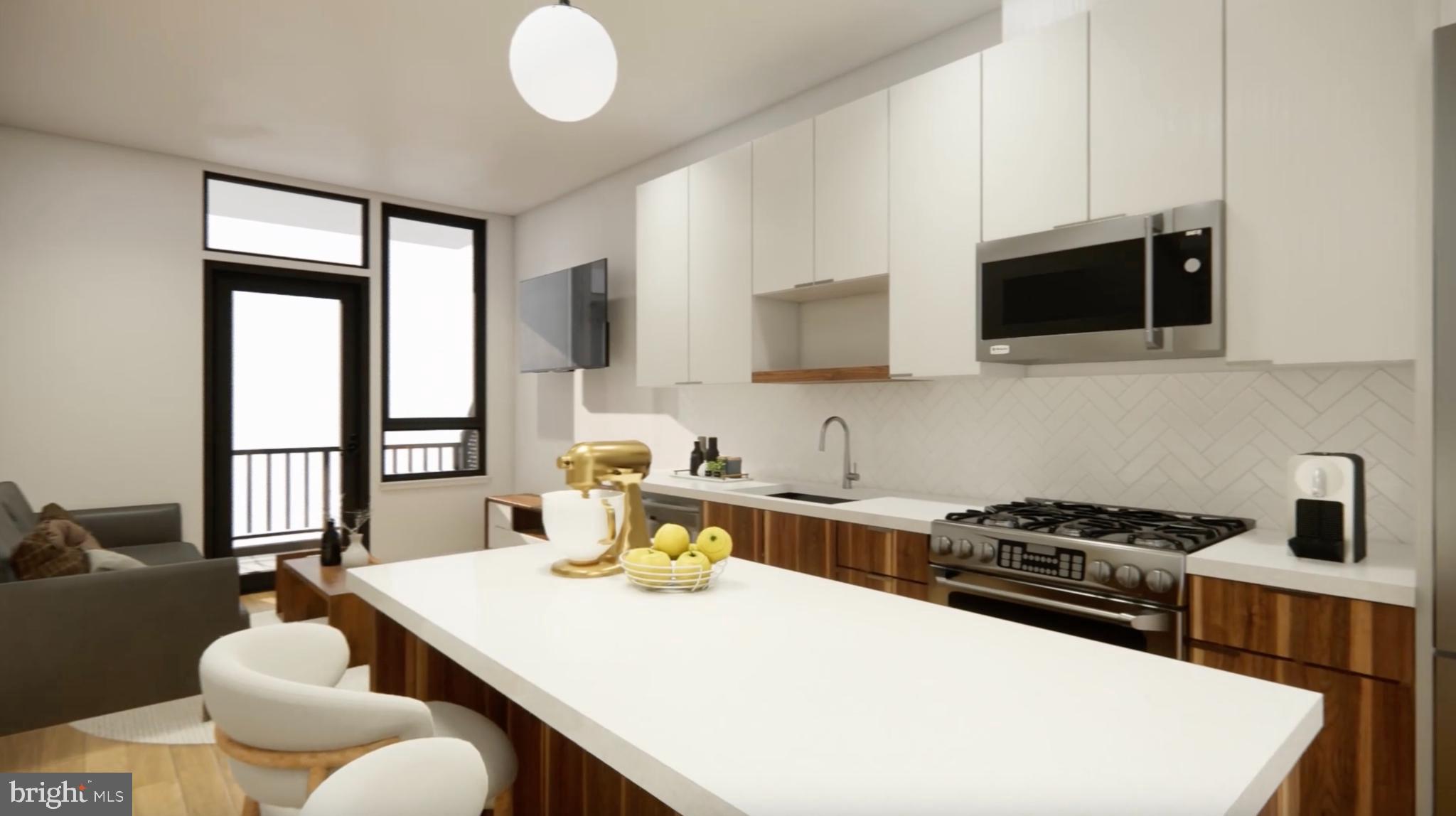 7175 12th Street Northwest, Unit 608 Washington, DC 20012 - Photo 5 of 24 a kitchen with a stove a sink and a microwave