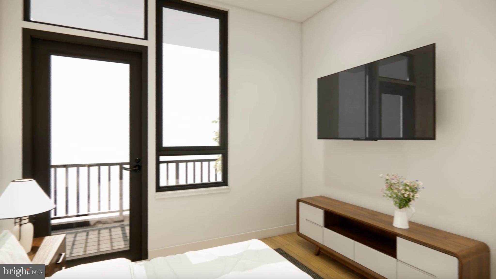 7175 12th Street Northwest, Unit 608 Washington, DC 20012 - Photo 7 of 24 a view of a hallway with wooden floor and a bathroom