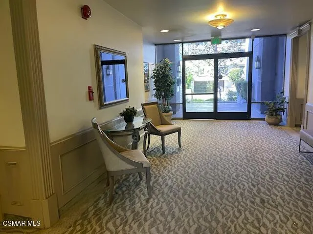 a view of a room with a window and wooden floor