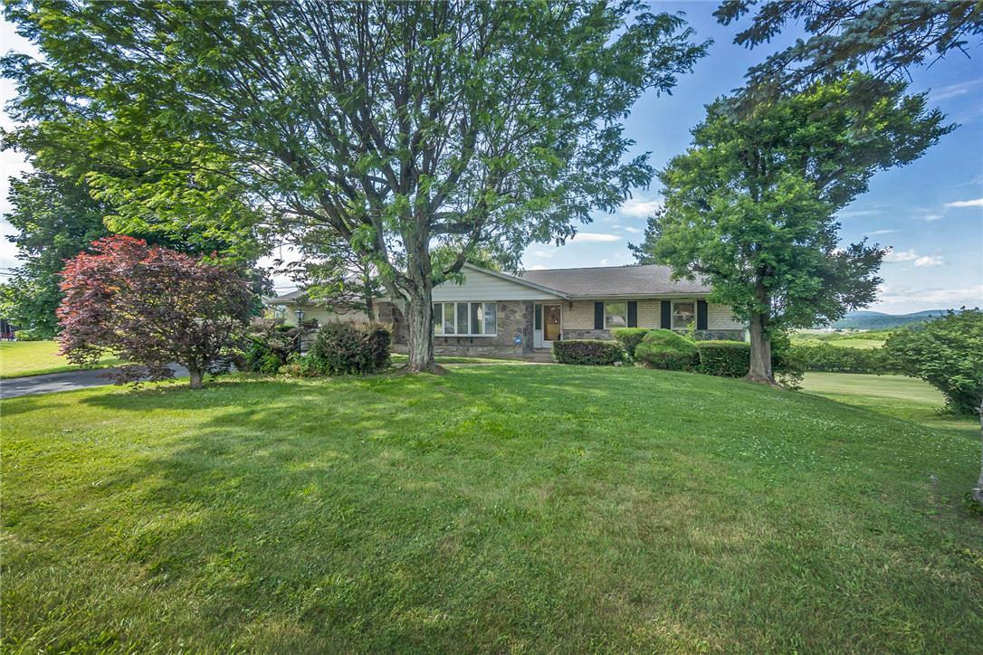 1657 Clearview Road Coplay, PA 18037 - Photo 2 of 77 Mature trees and neat landscaping frame this welcoming residence with distant scenic views.