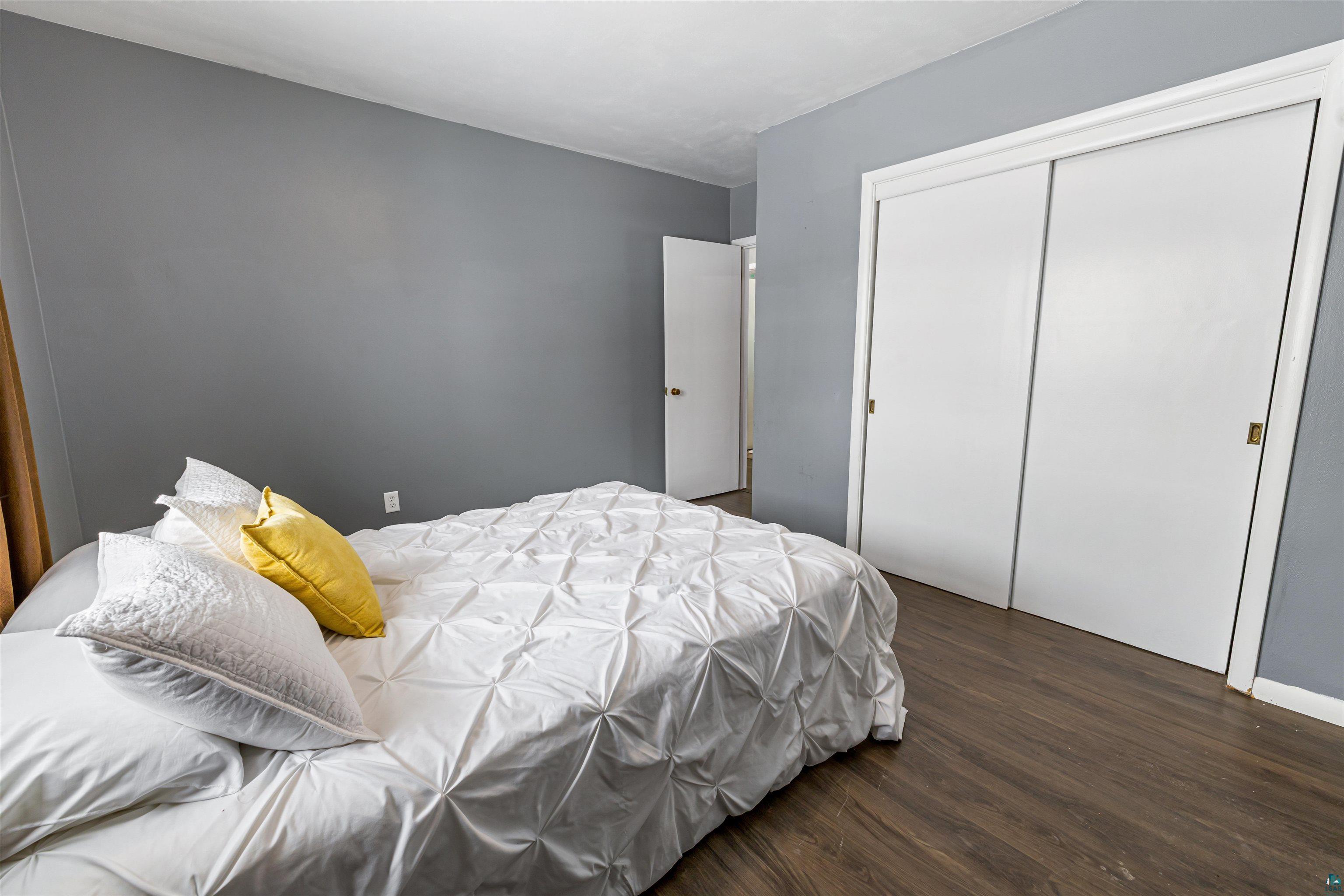 1101 13th Street South Virginia, MN 55792 - Photo 20 of 43 Bedroom with dark laminate finished floor and a closet