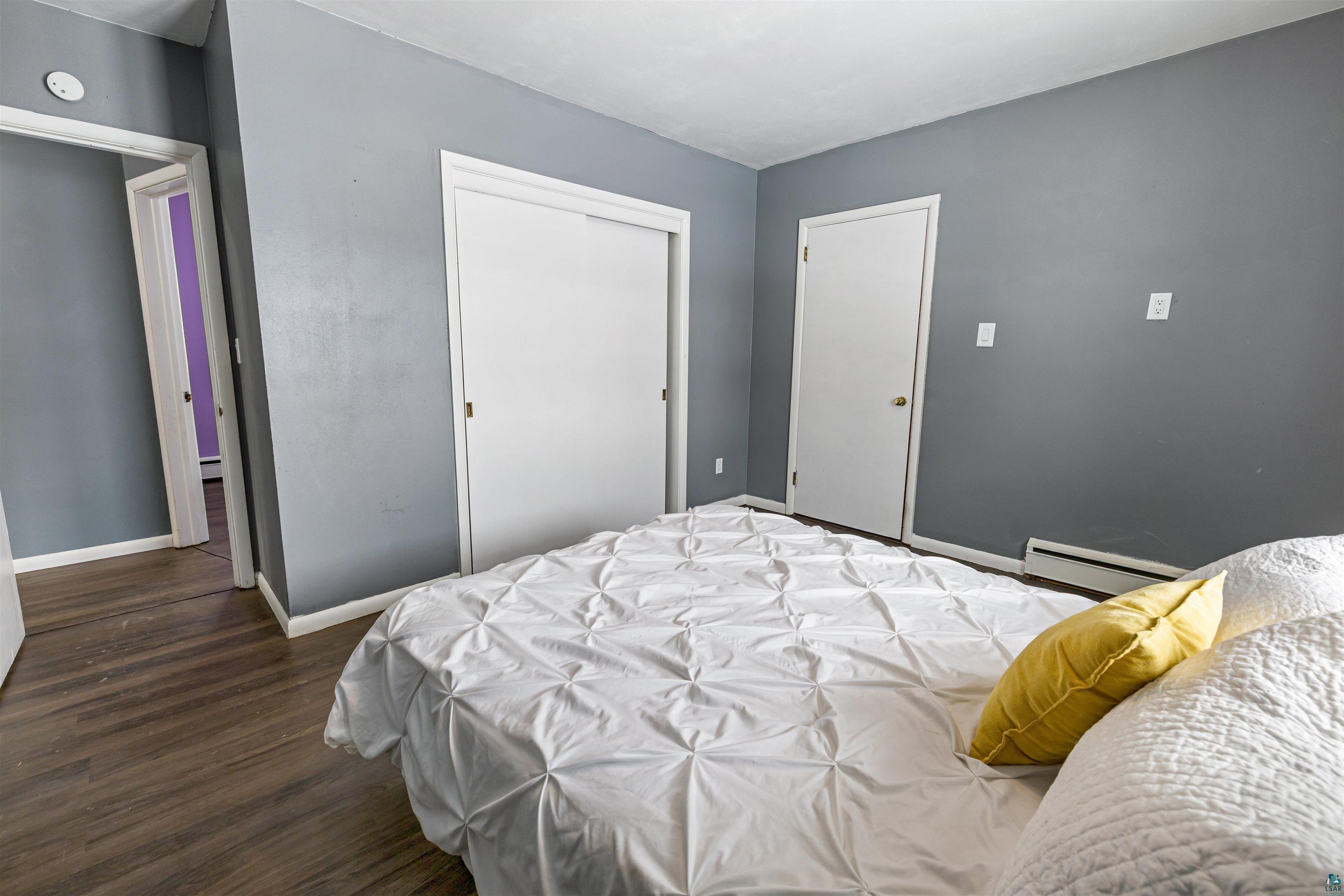 1101 13th Street South Virginia, MN 55792 - Photo 21 of 43 Bedroom with dark laminate finished floor and a closet