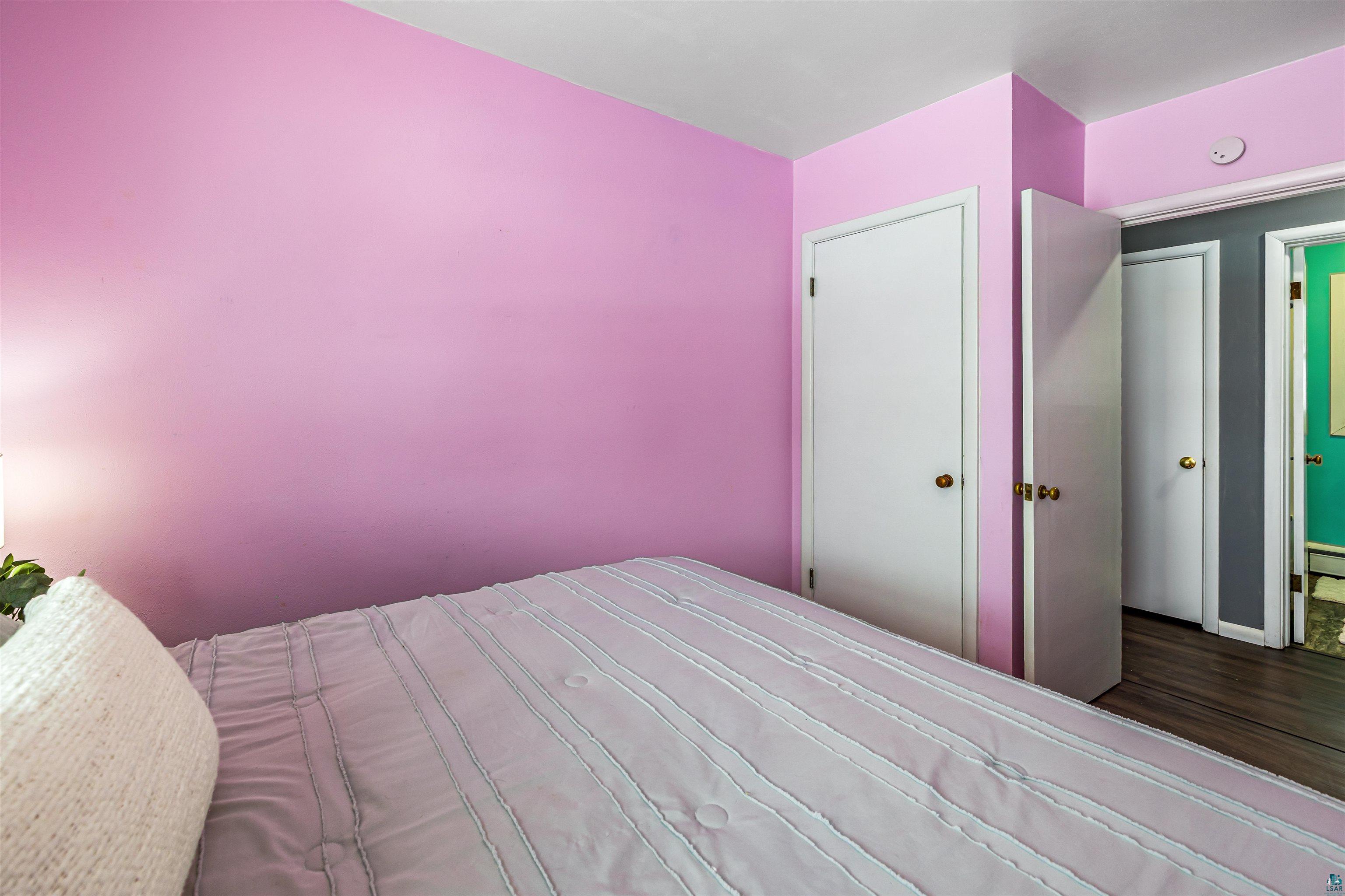 1101 13th Street South Virginia, MN 55792 - Photo 23 of 43 Bedroom with dark laminate finished floor and a closet
