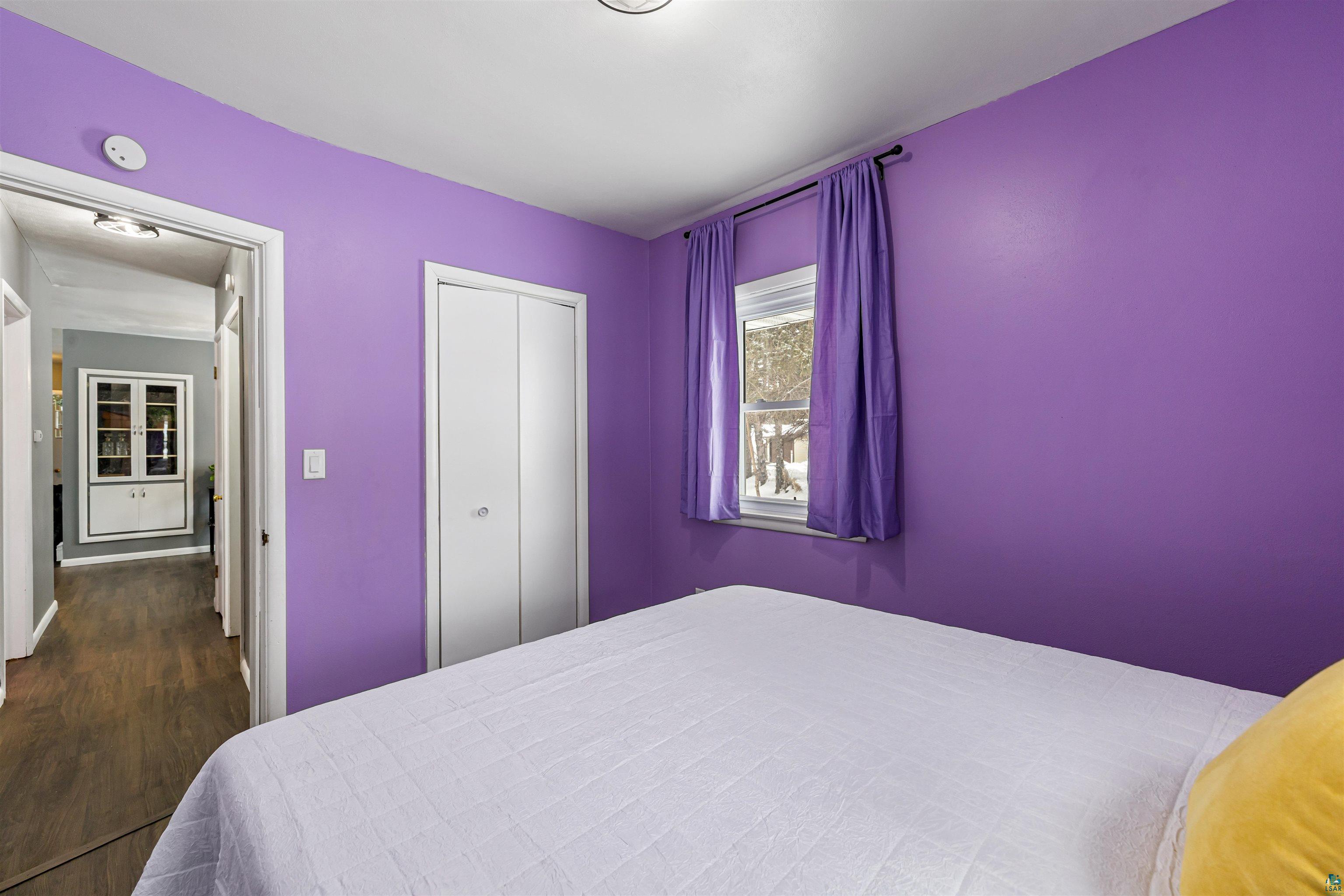 1101 13th Street South Virginia, MN 55792 - Photo 25 of 43 Bedroom with dark laminate finished floor and a closet