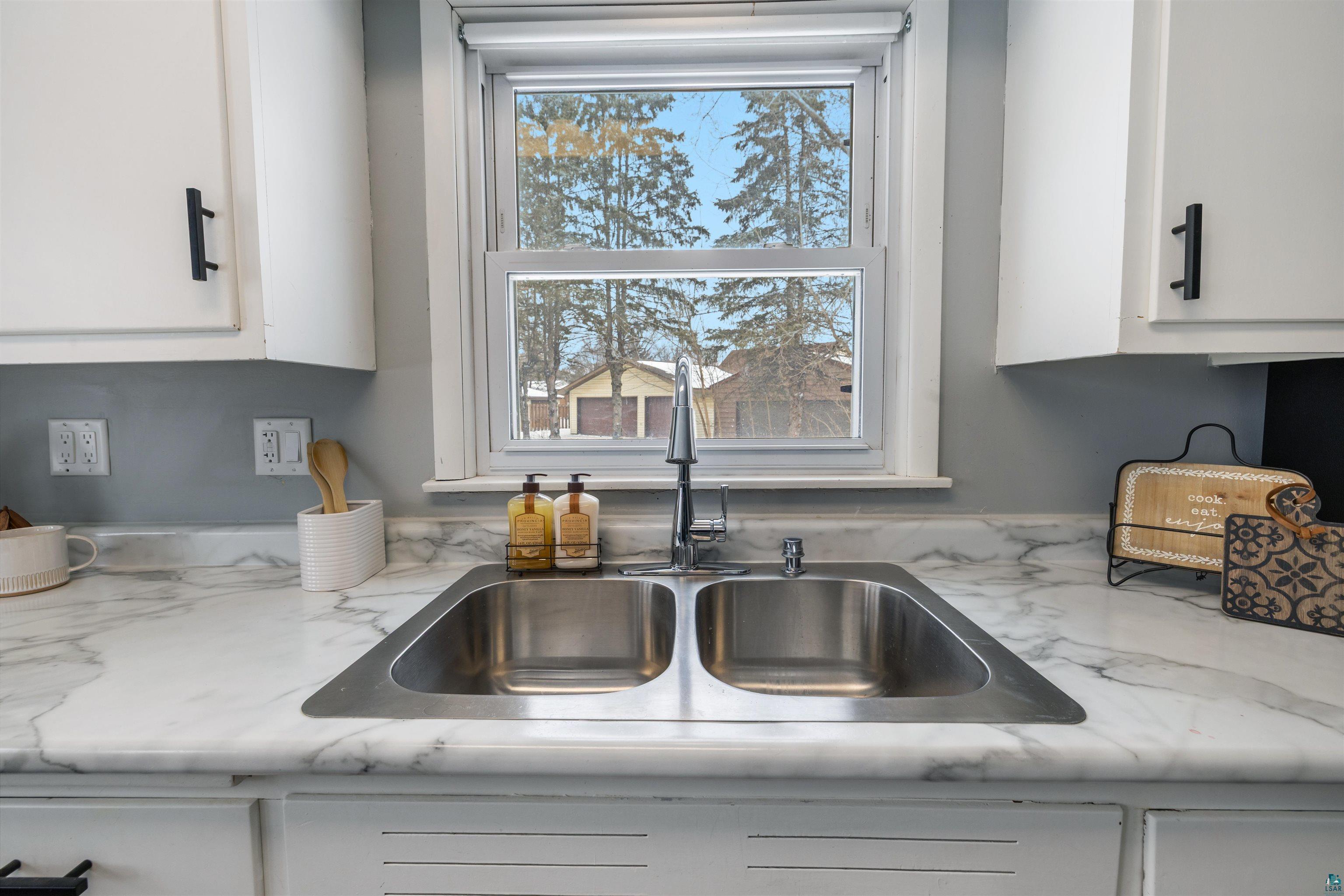 1101 13th Street South Virginia, MN 55792 - Photo 5 of 43 Kitchen view of white cabinets and a sink