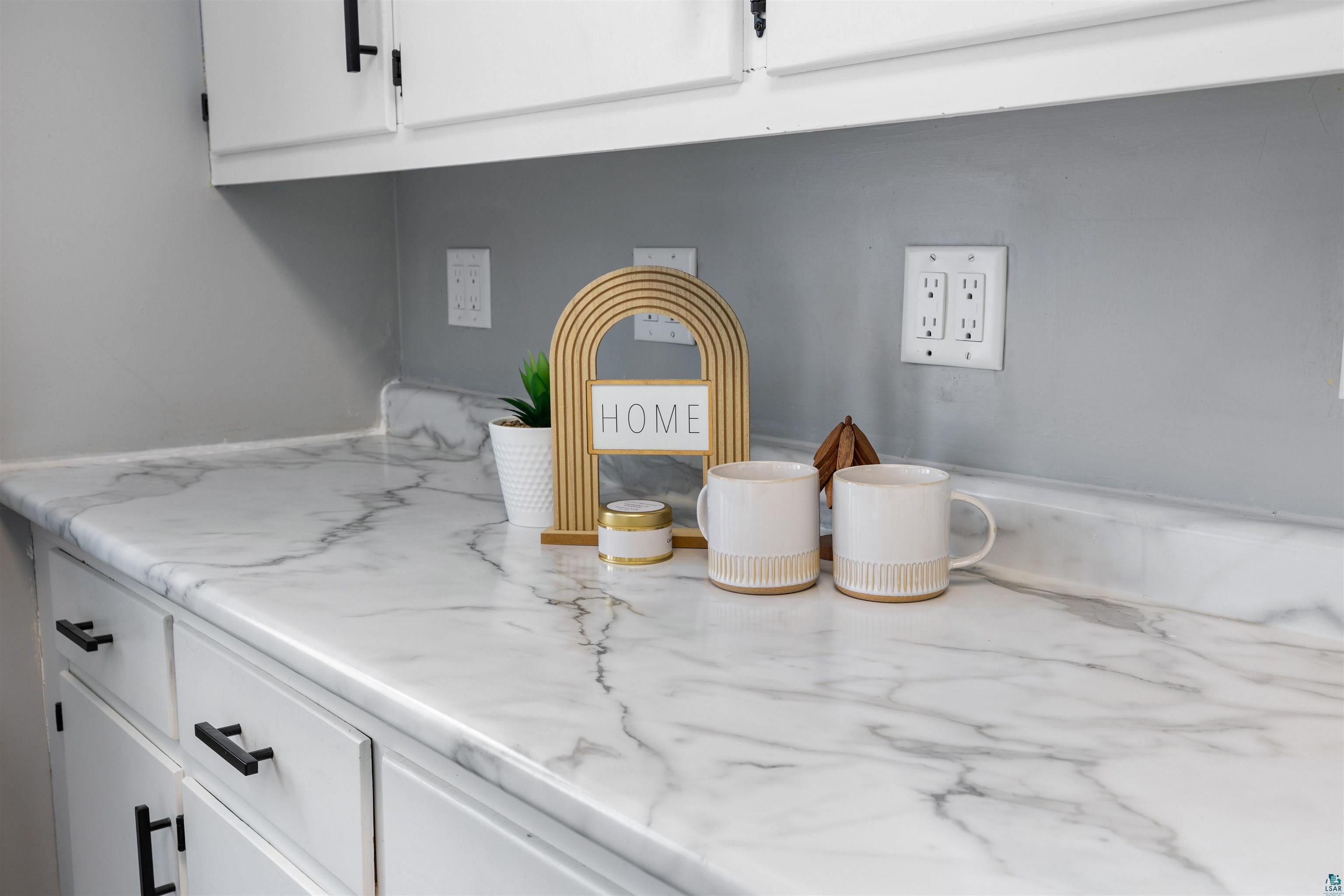 1101 13th Street South Virginia, MN 55792 - Photo 6 of 43 Kitchen view of white cabinets and light laminate countertops