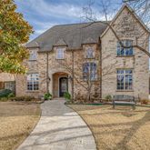 a front view of a house with yard