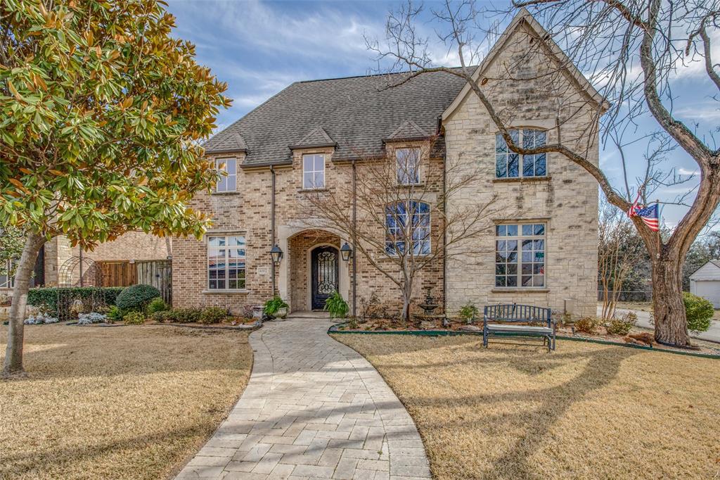 a front view of a house with yard