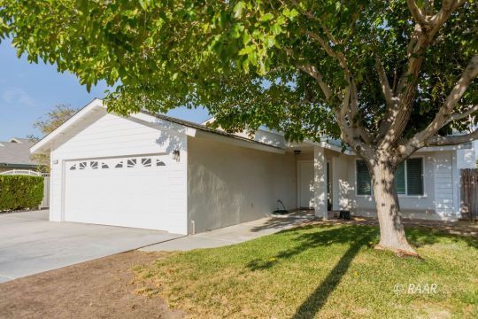 432 Ashton Street Ridgecrest, CA 93555 - Photo 3 of 31 a front view of a house with garden