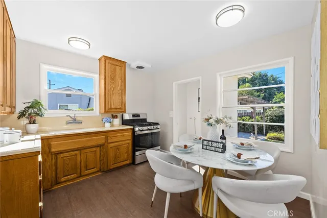 a kitchen with stainless steel appliances granite countertop a sink and stove