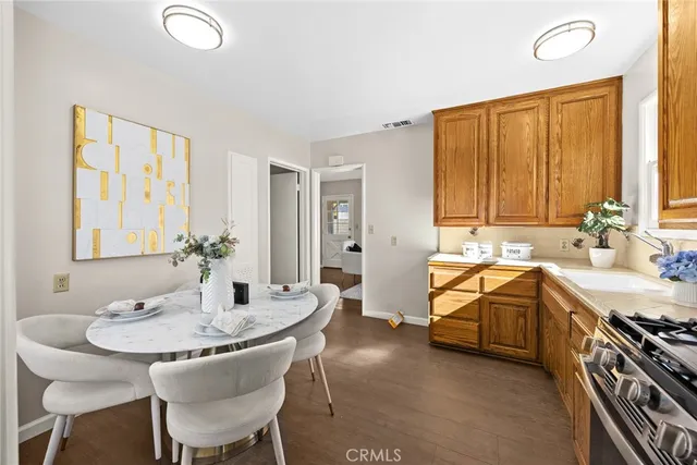 a spacious bathroom with a granite countertop sink and a bathtub