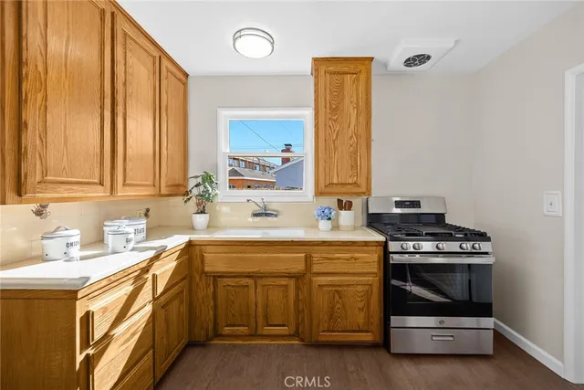 a kitchen with a stove and a sink