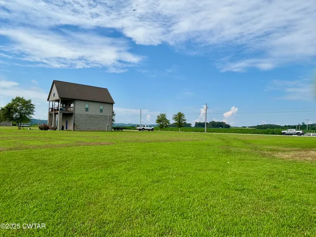 a backyard of a house with lots of green space