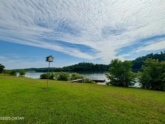 a view of a lake with a big yard