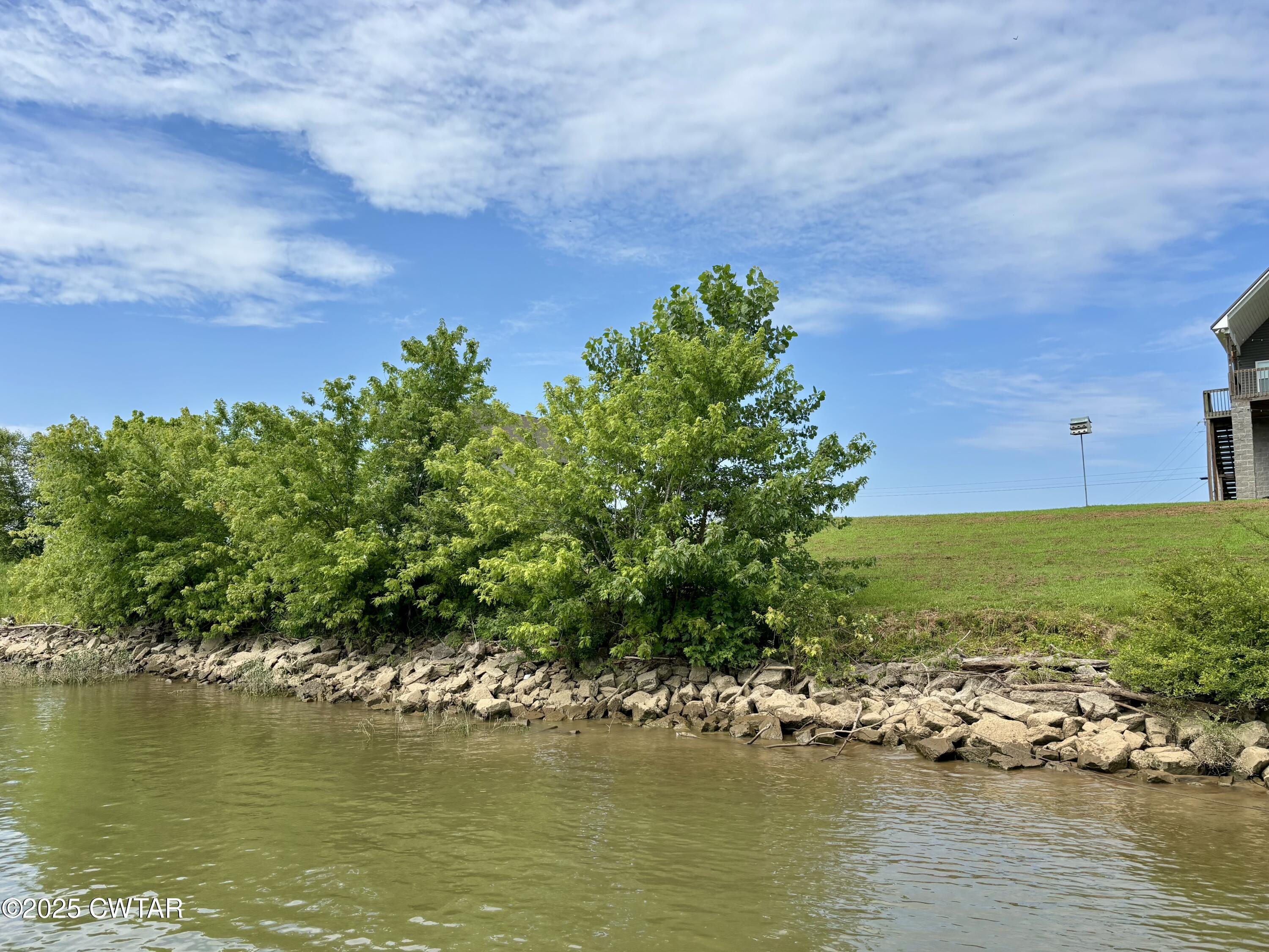 995 Hardin Bottom River Road Clifton, TN 38425 - Photo 7 of 8 an aerial view of ocean with residential houses with outdoor space