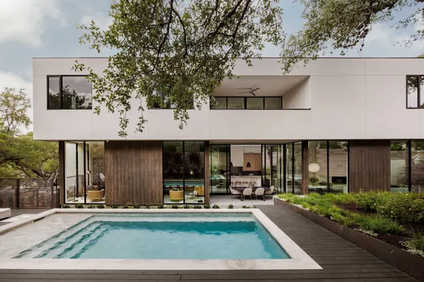 a front view of a house with sitting area