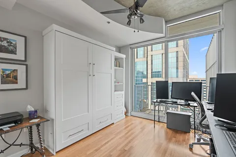 a bathroom with a granite countertop tub sink toilet and mirror