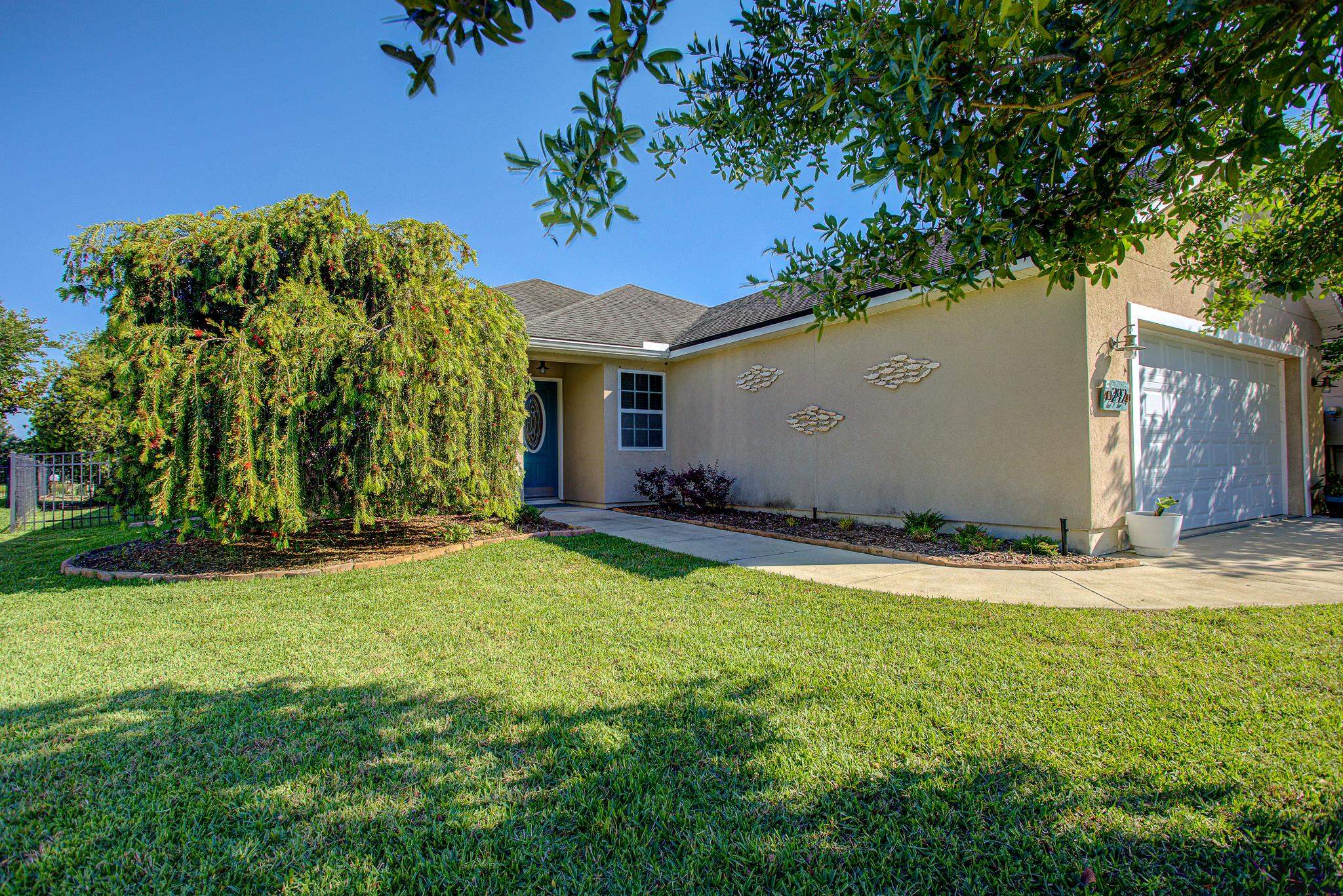 292 North Twin Maple Road St. Augustine, FL 32084 - Photo 76 of 79 a view of a house with a backyard