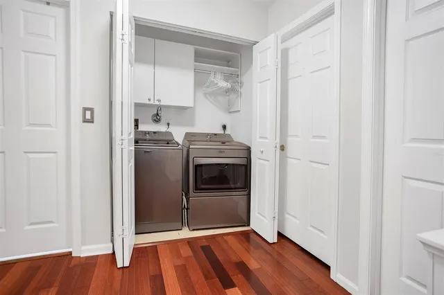 a kitchen with stainless steel appliances granite countertop a refrigerator and a stove