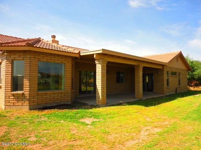5 Valencia Lane Rio Rico, AZ 85648 - Photo 12 of 13 a front view of a house with a yard