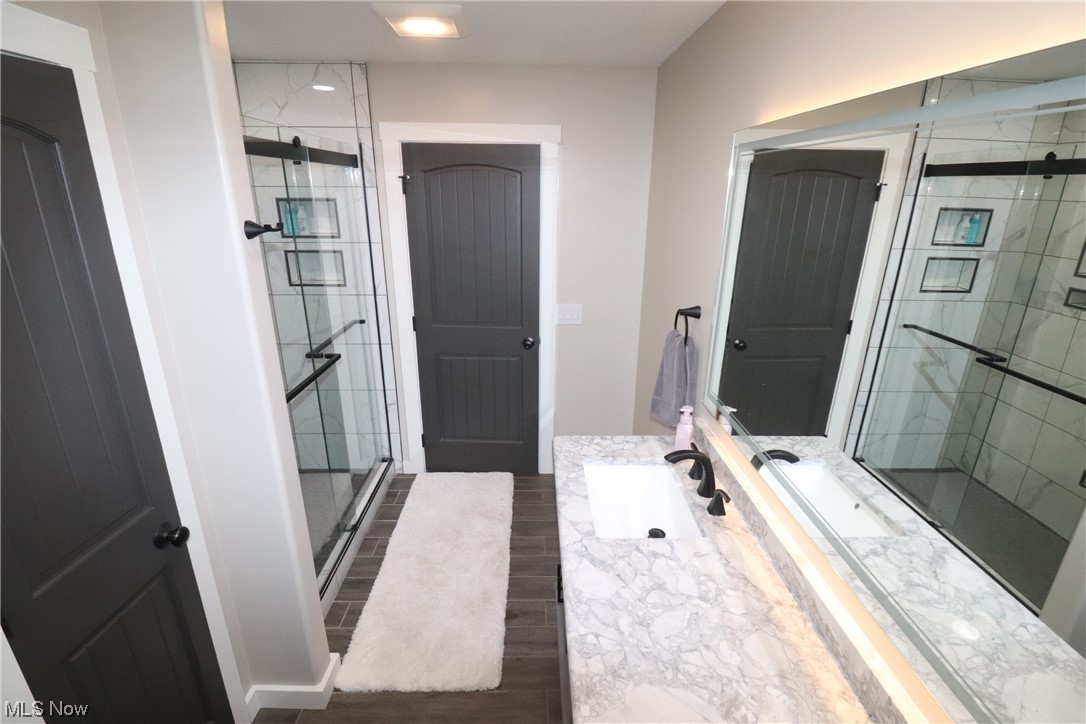 10582 Irvin Road Creston, OH 44217 - Photo 17 of 47 Bathroom featuring a shower and vanity
