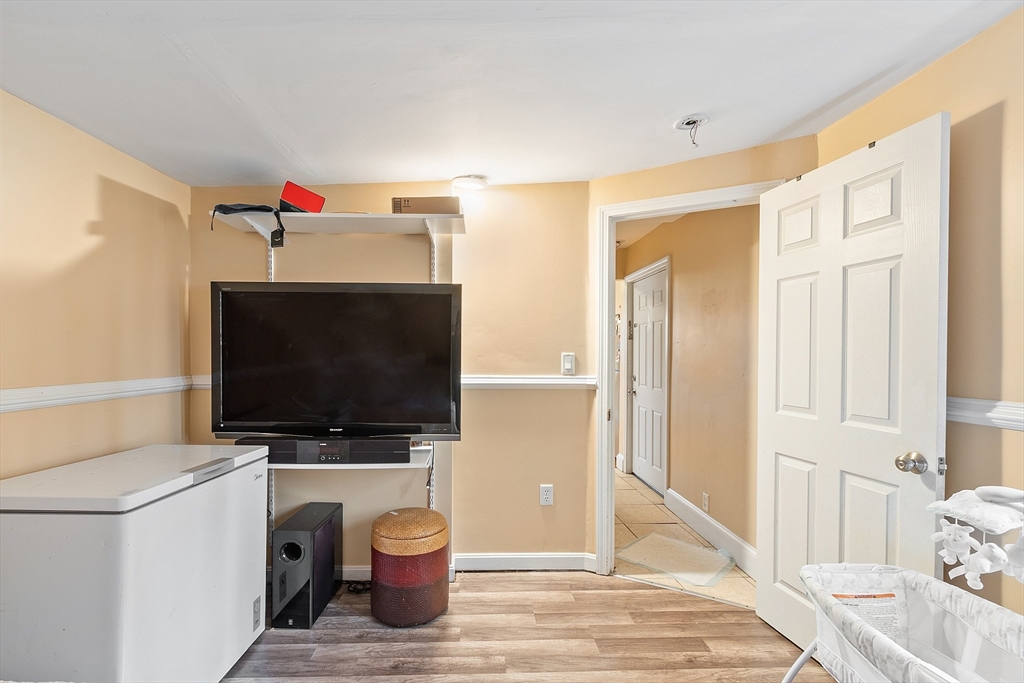 7 Washington Street Somerville, MA 02143 - Photo 15 of 27 a view of a livingroom with furniture and a flat screen tv