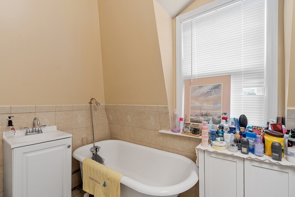 7 Washington Street Somerville, MA 02143 - Photo 19 of 27 a bathroom with a sink and a bathtub