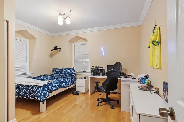 a bedroom with a bed and flat screen tv