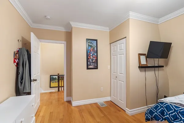 a bed room with a bed and a television