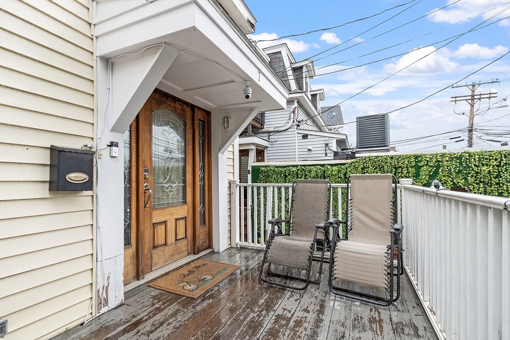 7 Washington Street Somerville, MA 02143 - Photo 3 of 27 a front view of a house with outdoor seating