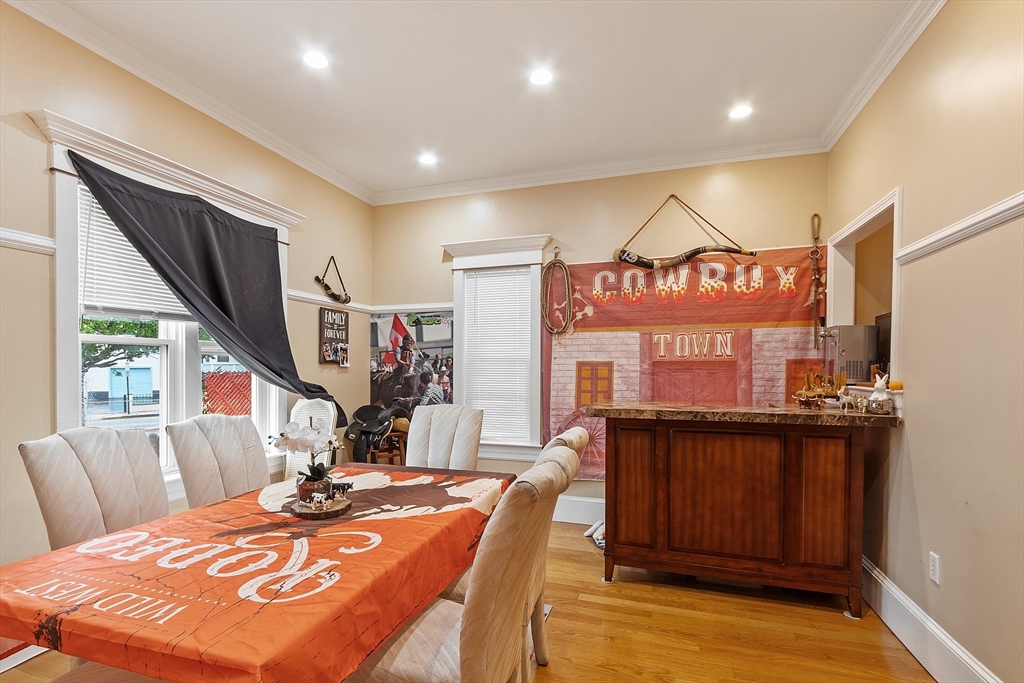 7 Washington Street Somerville, MA 02143 - Photo 8 of 27 a view of a dining room with furniture window and wooden floor