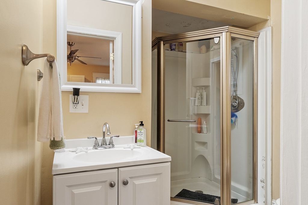 7 Washington Street Somerville, MA 02143 - Photo 9 of 27 a bathroom with a sink a toilet and shower