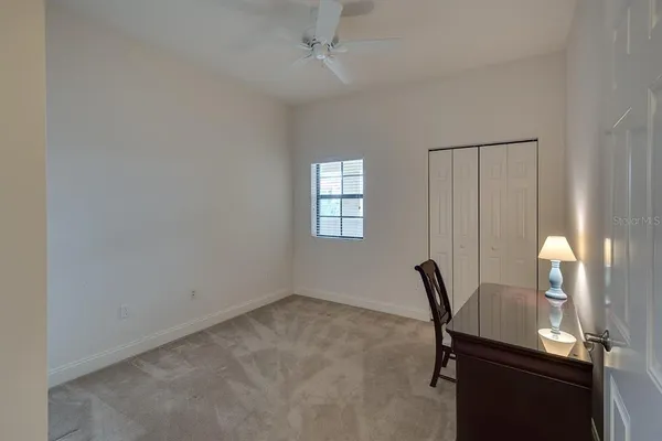a living room with furniture and a chair