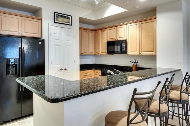 a living room with lots of furniture and a chandelier
