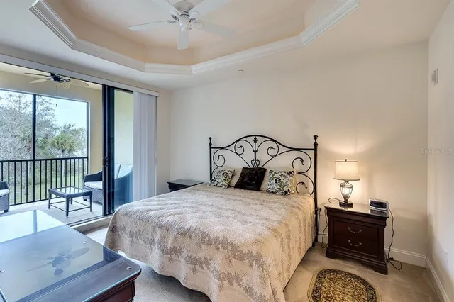 a bedroom with a bed and a dresser with mirror