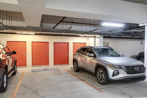 a view of parking garage with cars
