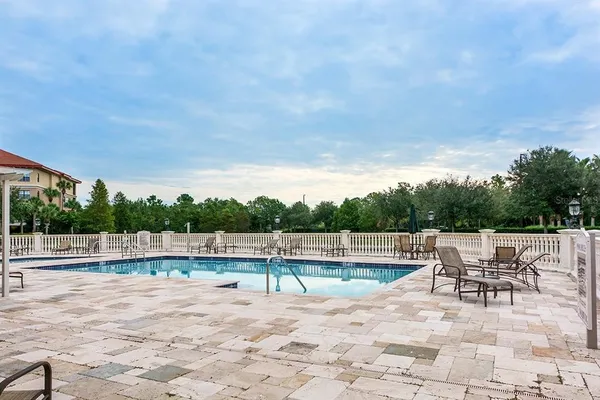 a view of swimming pool with seating space