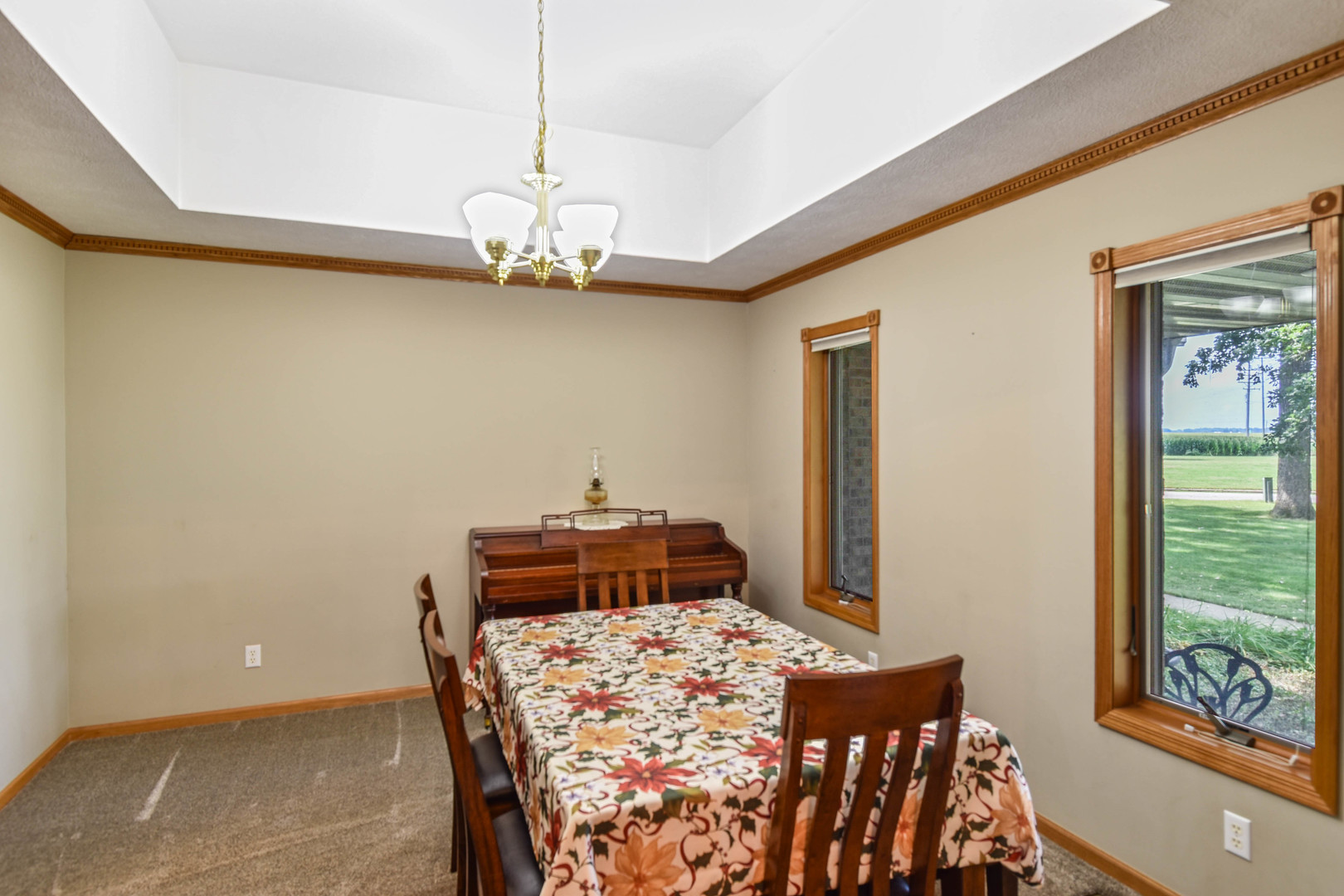 15799 East 2120 N Road Pontiac, IL 61764 - Photo 38 of 107 a bed room with a bed and a chandelier