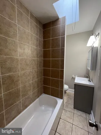 a view of a walk in closet and bathroom