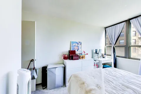 a bedroom with a bed and furniture