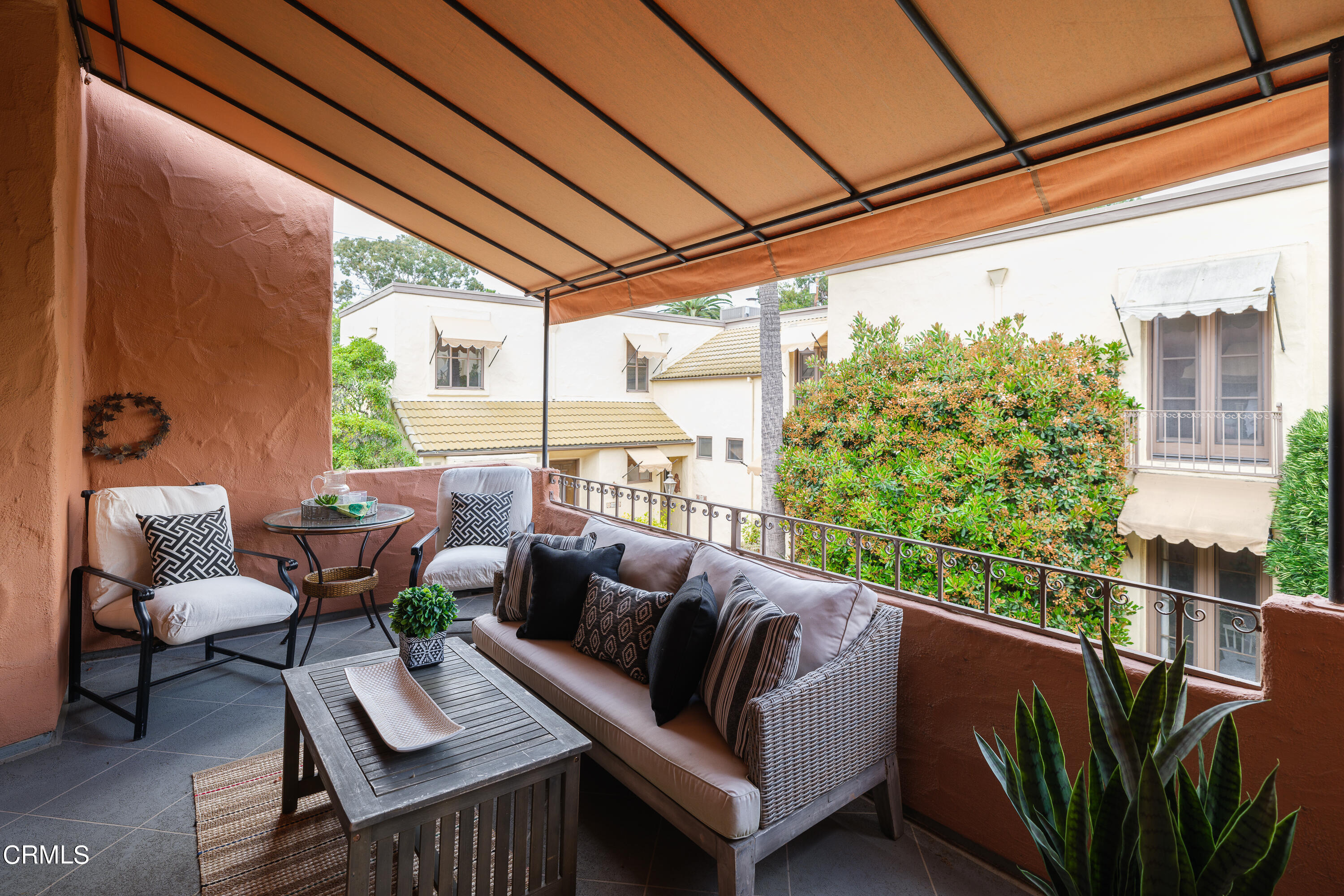 307 Arlington Drive Pasadena, CA 91105 - Photo 19 of 50 a balcony with furniture and a potted plant