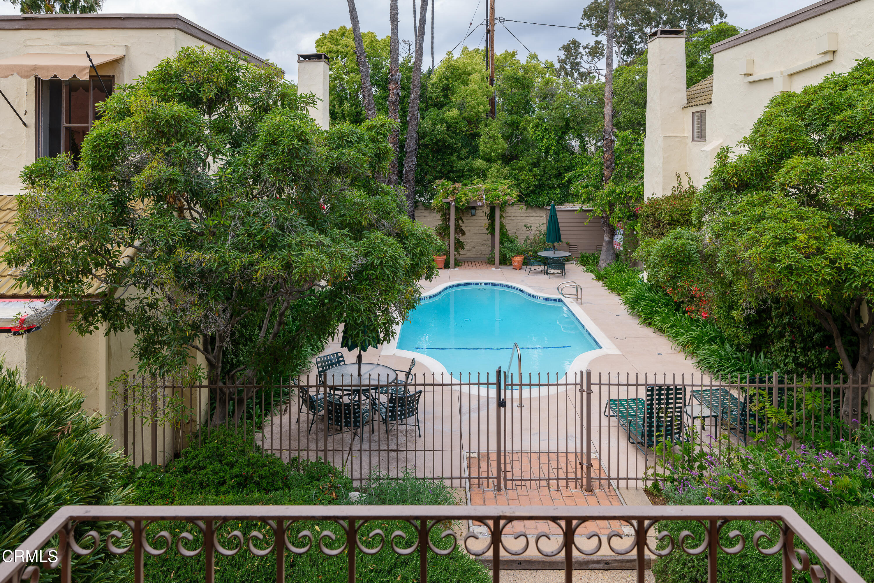 307 Arlington Drive Pasadena, CA 91105 - Photo 24 of 50 a view of a house with a yard and potted plants
