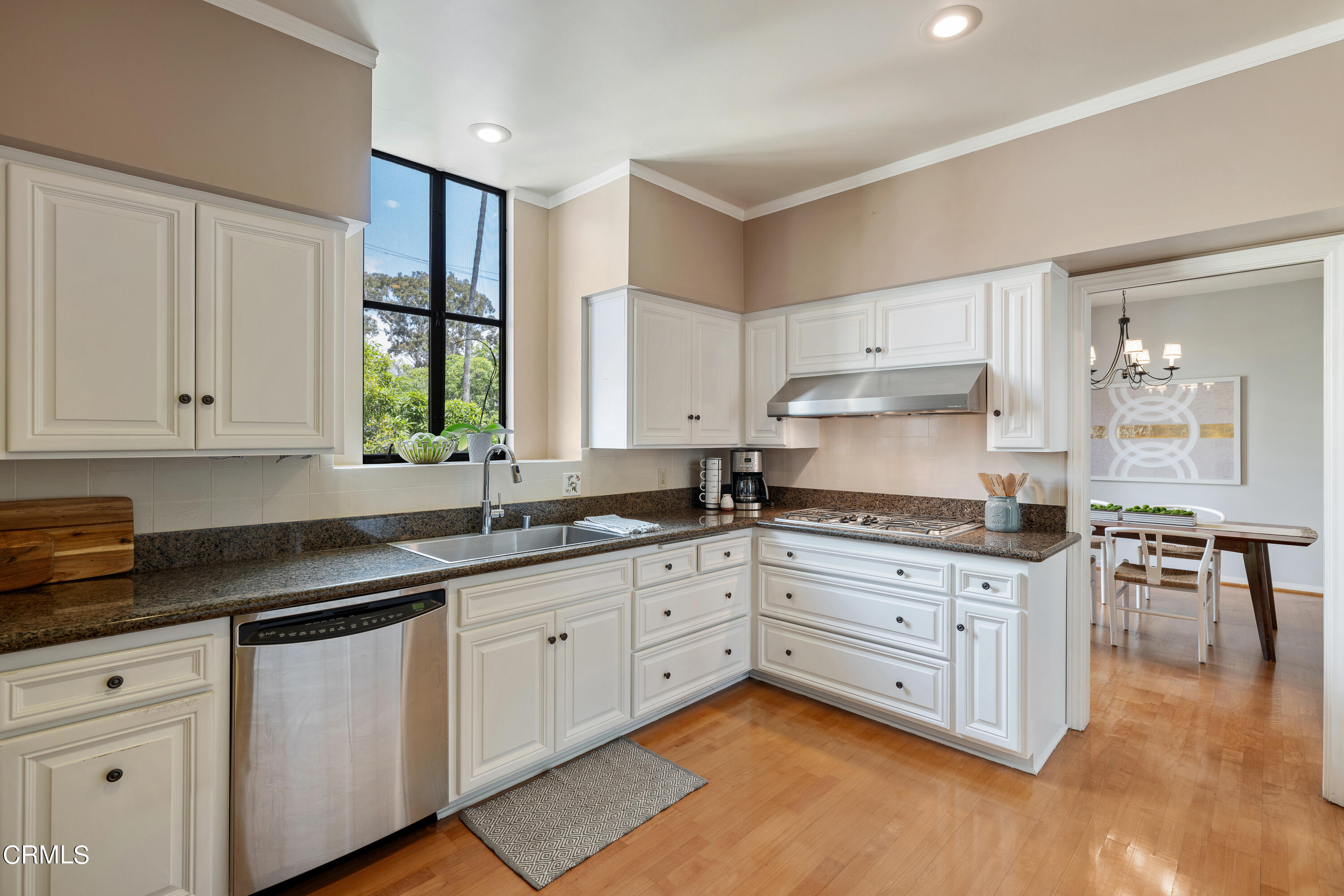 307 Arlington Drive Pasadena, CA 91105 - Photo 27 of 50 a kitchen with granite countertop white cabinets and white appliances